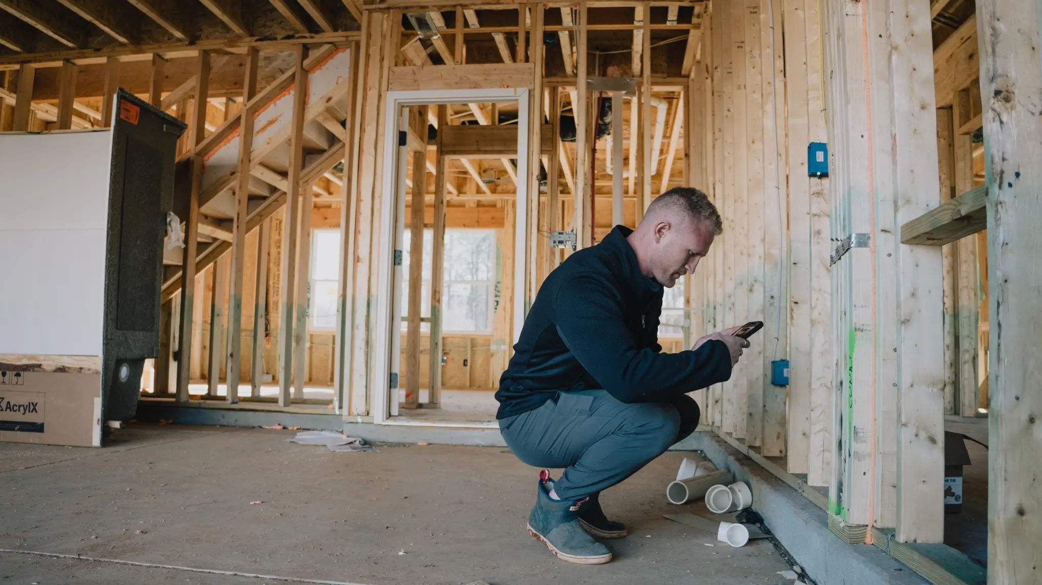 Open framing and rough-ins visible during construction