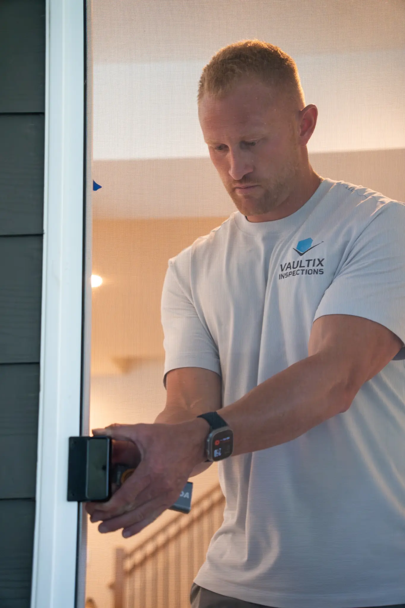 Vaultix inspector testing an exterior doorway during a residential inspection