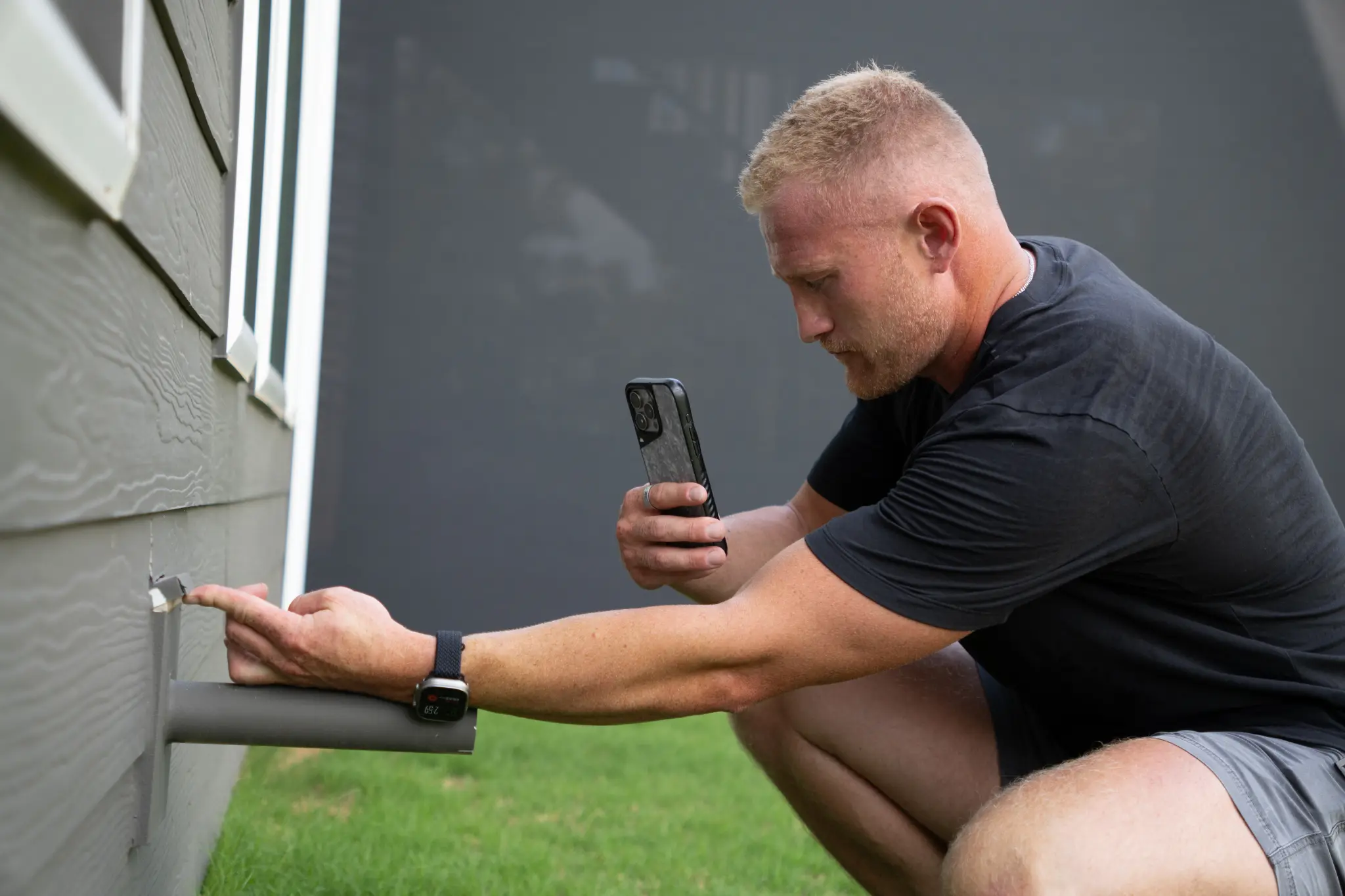 Inspector evaluating the exterior of a property